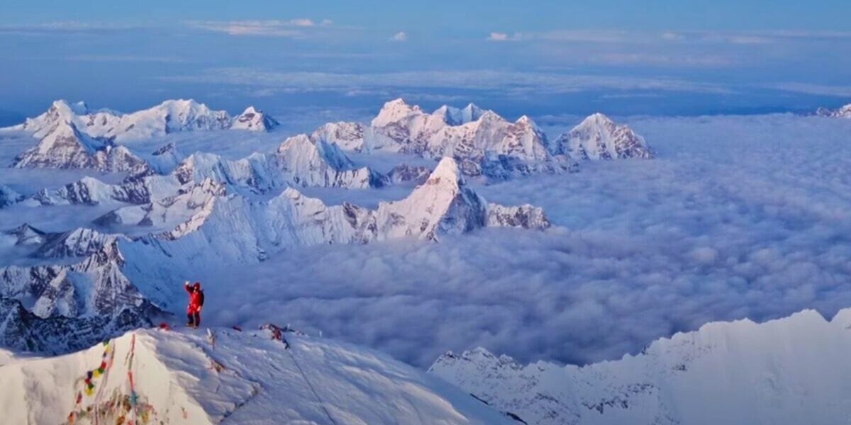 Everest mountain range and a climber