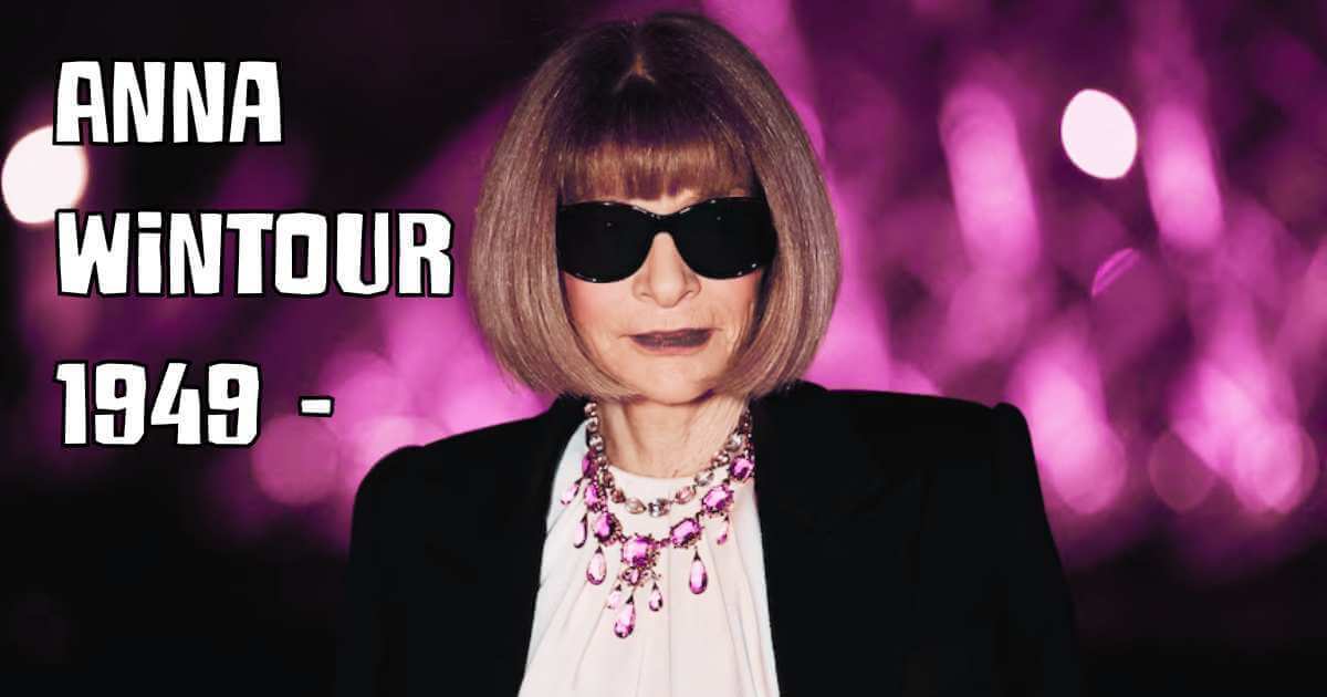 Anna Wintour in her signature black sunglasses, blonde bob haircut, and black blazer with ornate jewelry, against a purple bokeh background, with text reading 'ANNA WINTOUR 1949 -