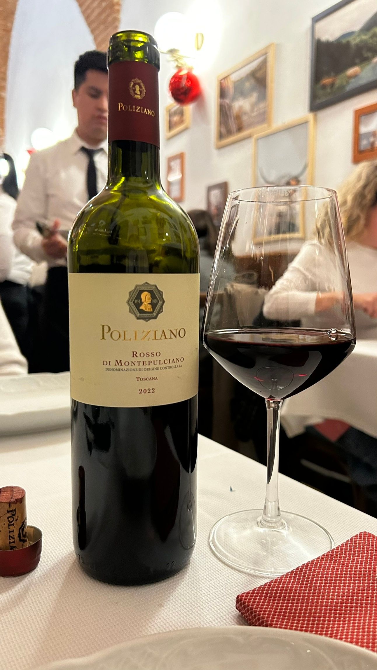 A bottle of Rosso di Montepulciano 2022, a smooth Tuscan red wine with notes of cherry and plum. Perfectly paired with a Florence steak and stored safely in Jimmy the Fox Bottle Italy Wine Travel Bag.