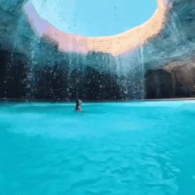 someone swimming in a big pool