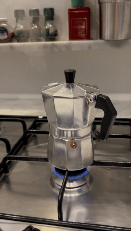 A traditional Italian moka pot brewing rich, aromatic coffee—just like a morning in Florence before heading to a wine-tasting adventure with Jimmy the Fox Bottle Italy Wine Travel Bag.