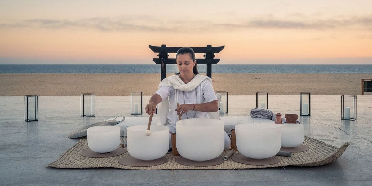 a person doing a sound bath in Los Cabos