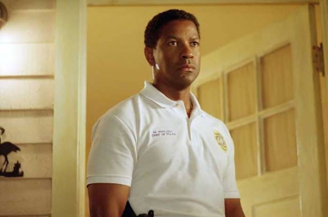 Screenshot of Denzel Washington in Out of Time, wearing a police uniform and looking intensely off-camera.