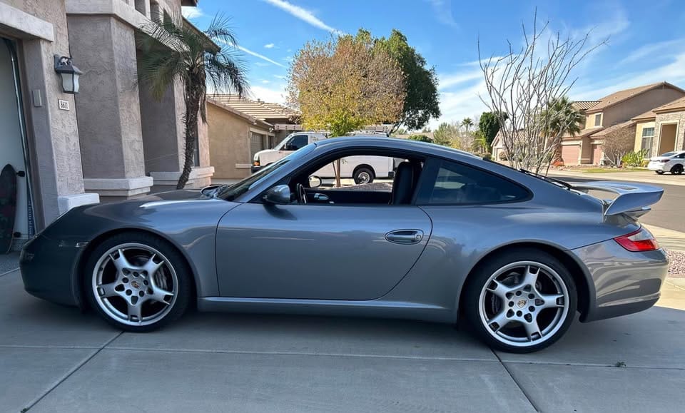 Seal Grey Metallic 2005 Porsche 997 Carrera 2 with Sport Chrono, PASM, and 19" Carrera S wheels, listed for $35,000 in Peoria, AZ. 