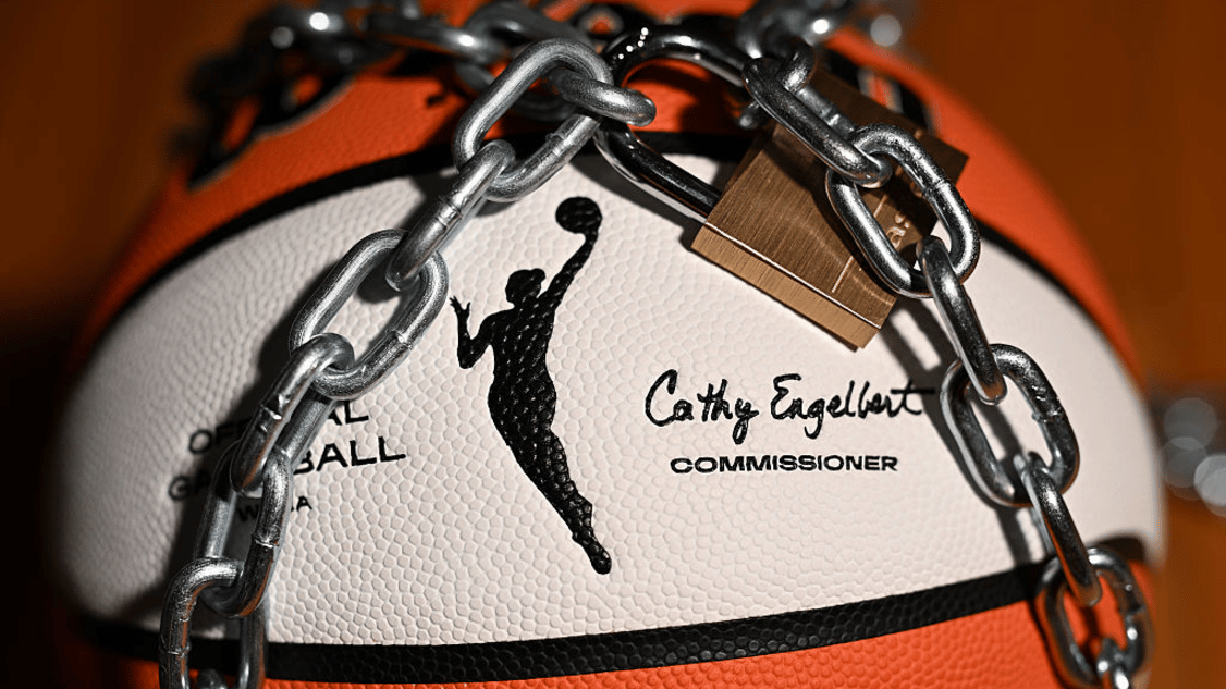 An Official Wilson WNBA basketball sits with a lock and chain to represent a potential lockout between the Women's National Basketball Association (WNBA) and the Women's National Basketball Players Association (WNBPA) on October 15, 2025 in Whitestown, IN.