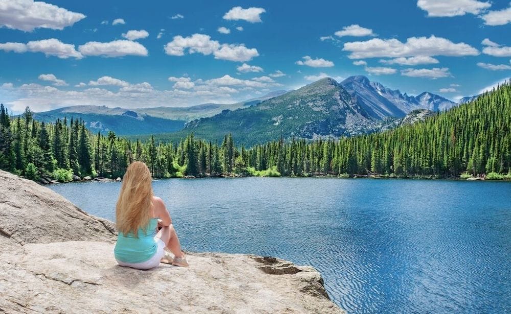 a hiker overlooking a lake