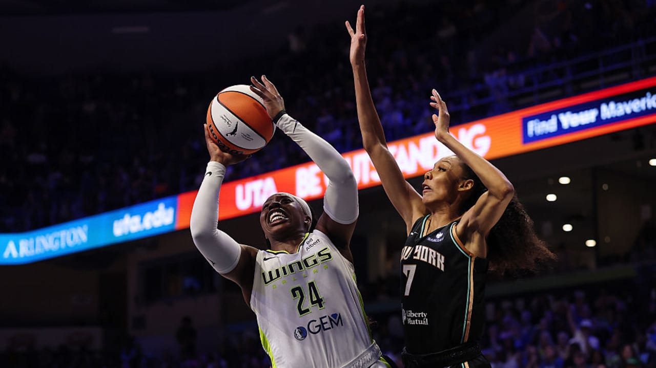 Arike Ogunbowale #24 of the Dallas Wings drives to the basket against Rebekah Gardner #7 of the New York Liberty during the second half of a game at College Park Center on July 28, 2025 in Arlington, Texas. 
