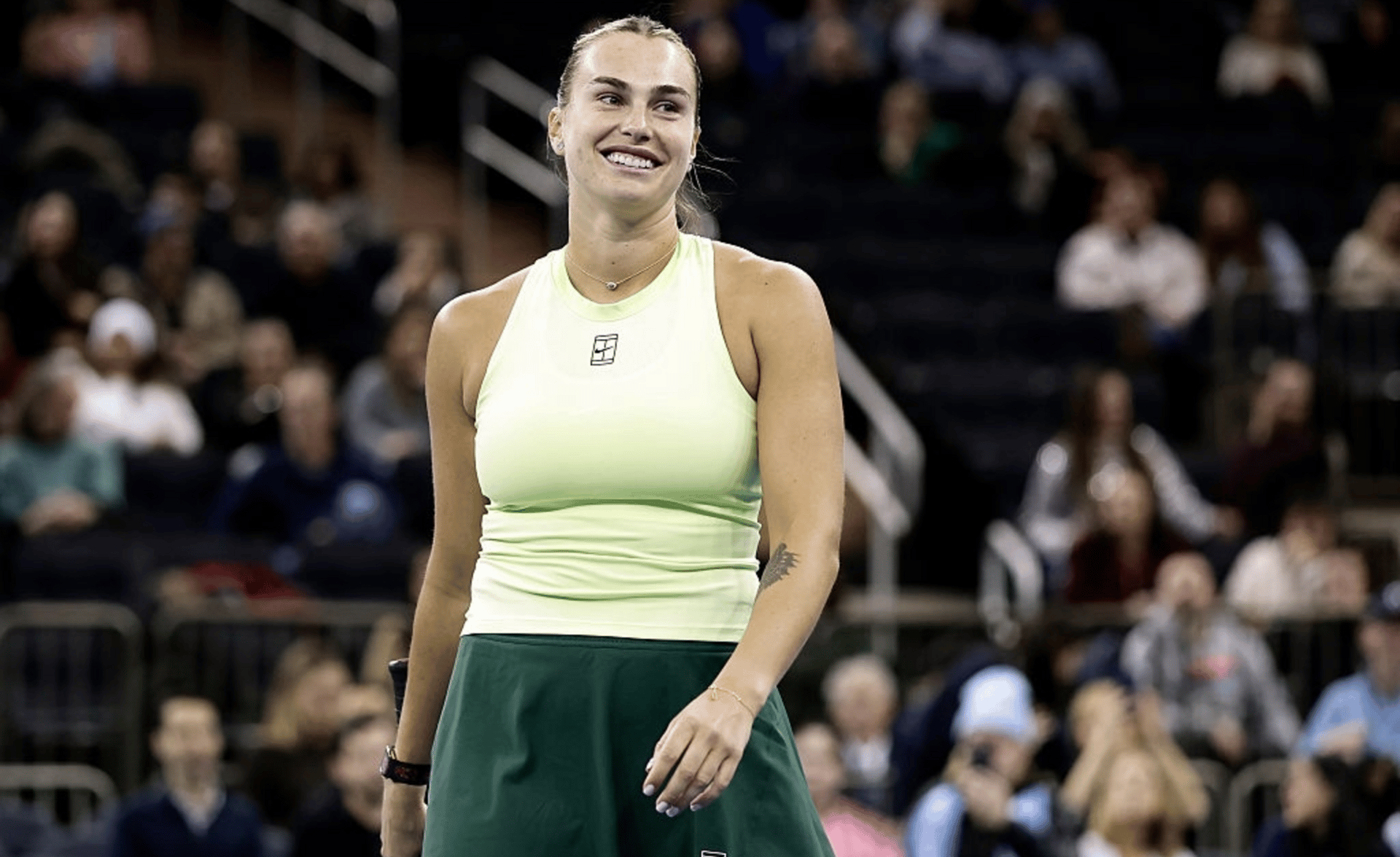 Aryna Sabalenka reacts playing with Tommy Paul of the United States against Naomi Osaka of Japan and Nick Kyrgios of Australia