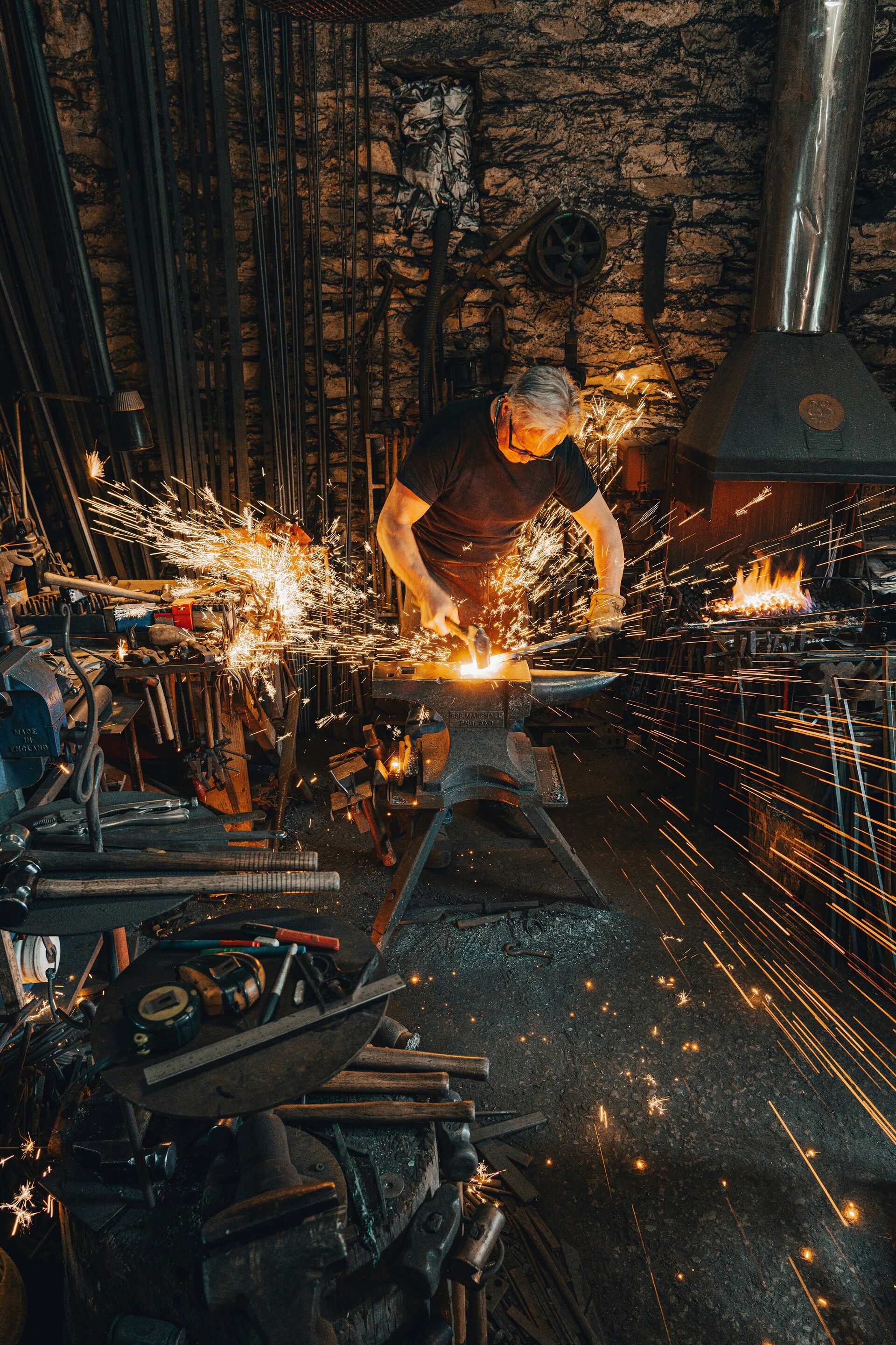 Man hammering a hot piece of metal