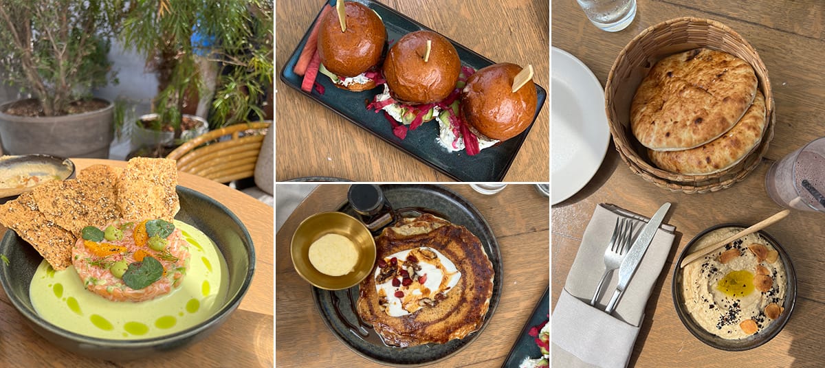 Selection of Mediterranean brunch dishes at Calabra in Santa Monica including salmon tartare, hummus with pita bread, pancakes, and mini burgers served in a relaxed rooftop setting