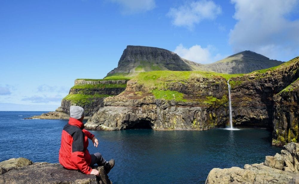 an explorer enjoying Faroe Islands