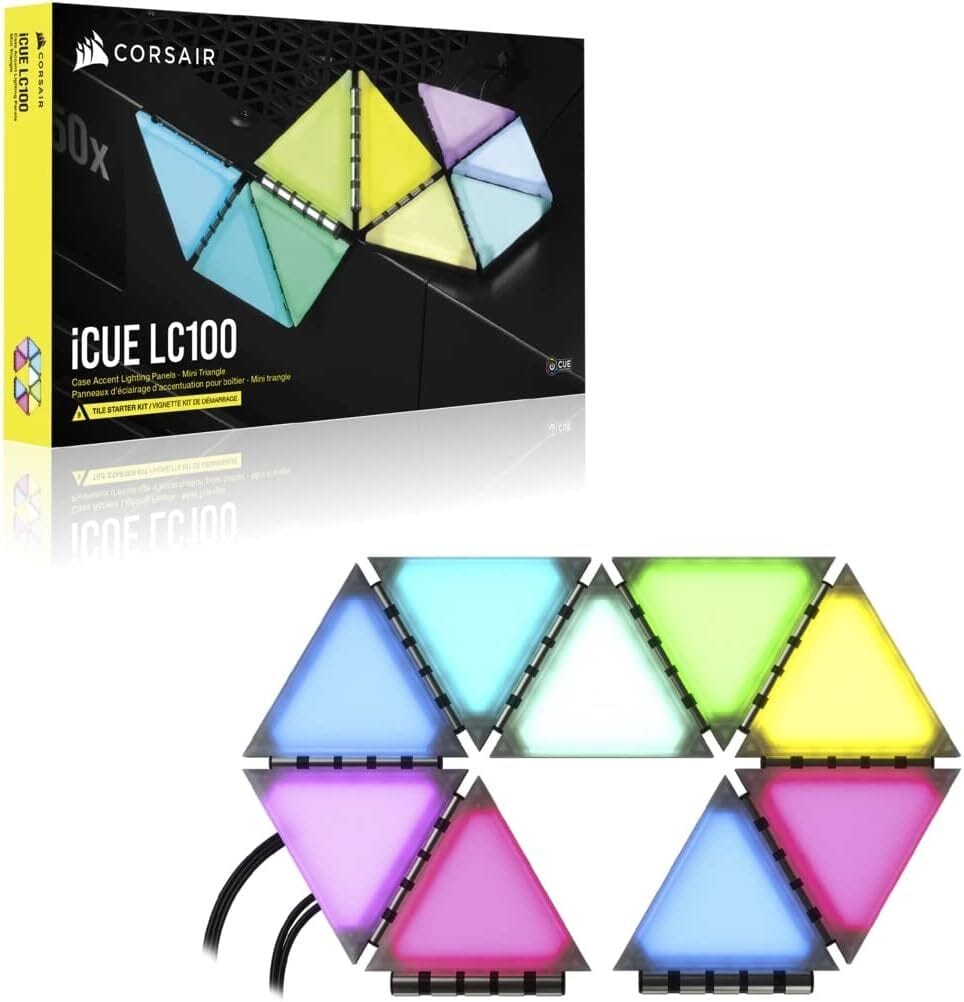 Corsair iCUE LC100 Mini Triangles – Desk Ambience Goals Small triangular RGB panels placed beside a PC monitor, diffusing smooth ambient light synced with Corsair iCUE gear.