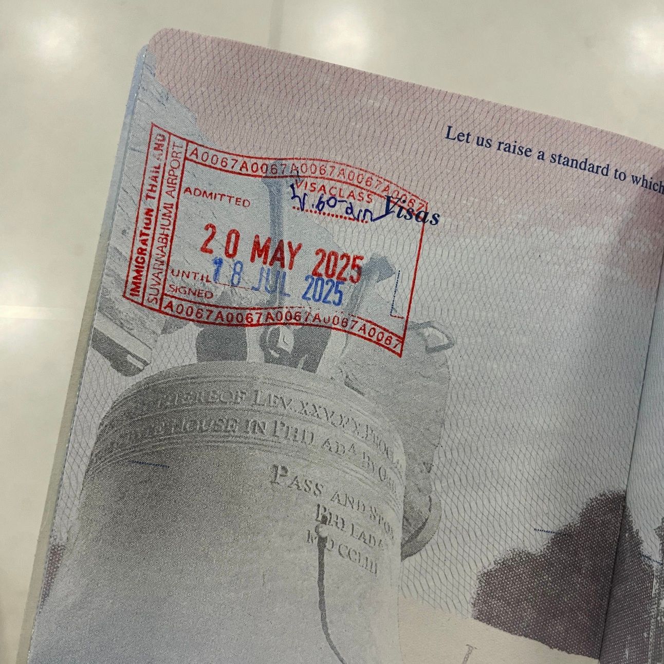 A U.S. passport with a Thai visa stamp with an admittance date of May 20, 2025.