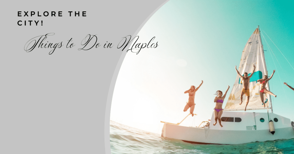A couple of people jumping off a boat in the ocean.