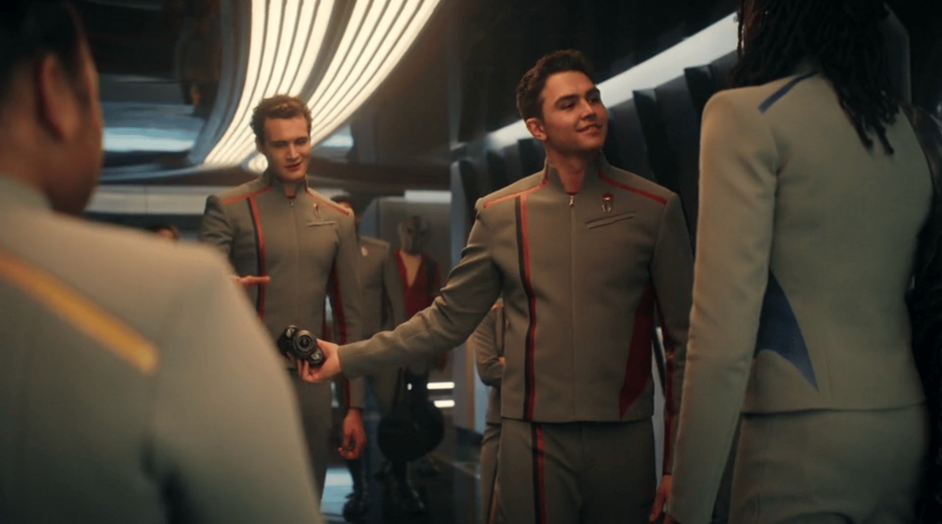 Daremy passing off Jay'Den's binoculars to his lackey.