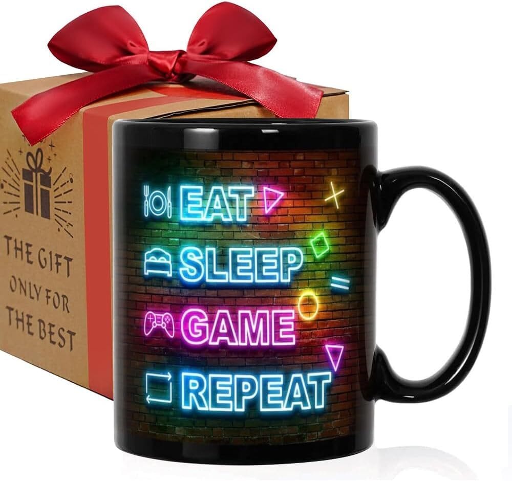 “Eat. Sleep. Game. Repeat.” Mug – The Gamer Mantra Alt text: Simple, bold mug featuring "Eat. Sleep. Game. Repeat." slogan, perfect for casual and hardcore gamers alike.