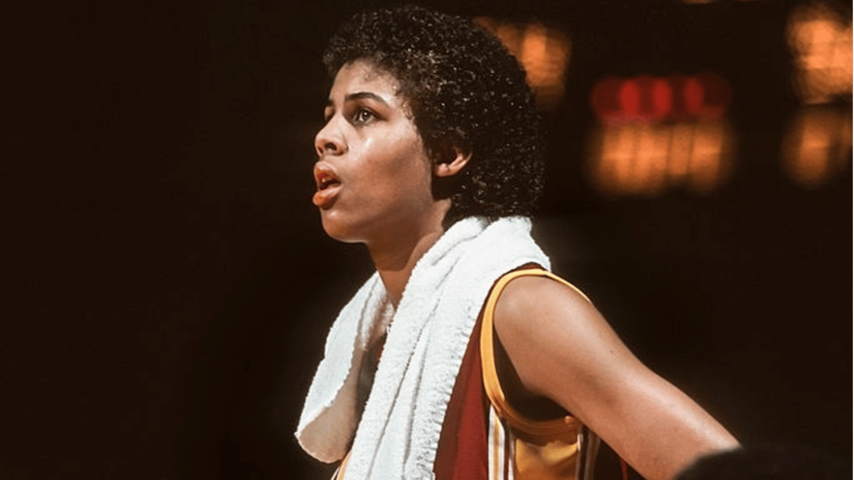 Cheryl Miller #31 of the USC Trojans watches from the sidelines during an NCAA women's basketball game against Stanford University played during February 1983