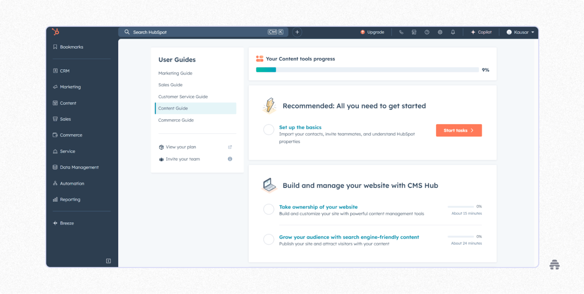 HubSpot dashboard showing onboarding tasks, content tool progress, and CMS Hub setup steps to help users build a website and grow their audience.