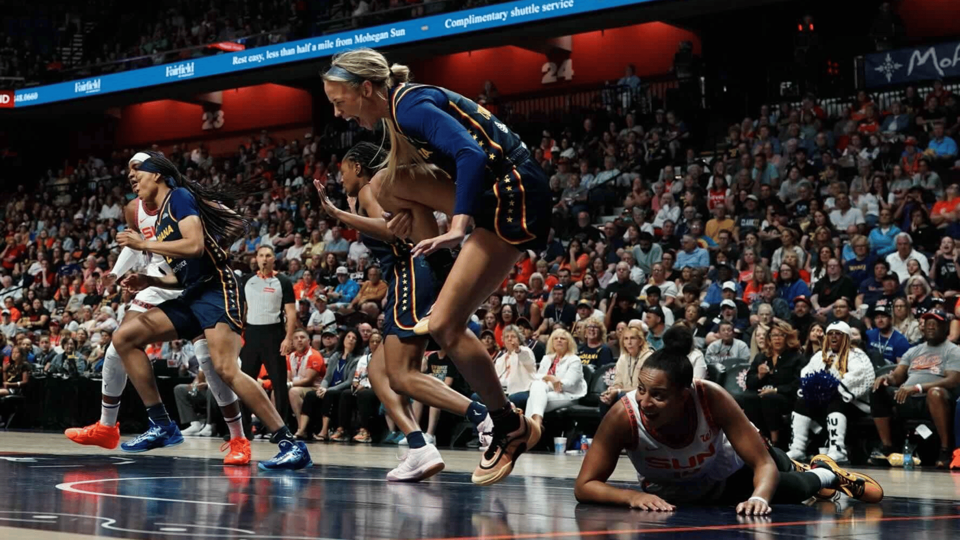 Indiana Fever guard Sophie Cunningham (8) is injured on a play against Connecticut Sun guard Bria Hartley (14) in the first half at Mohegan Sun Arena.