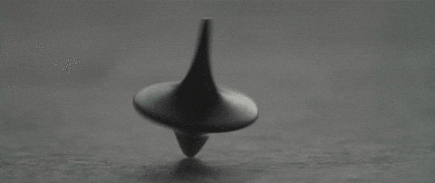 a spinning top on a tablee