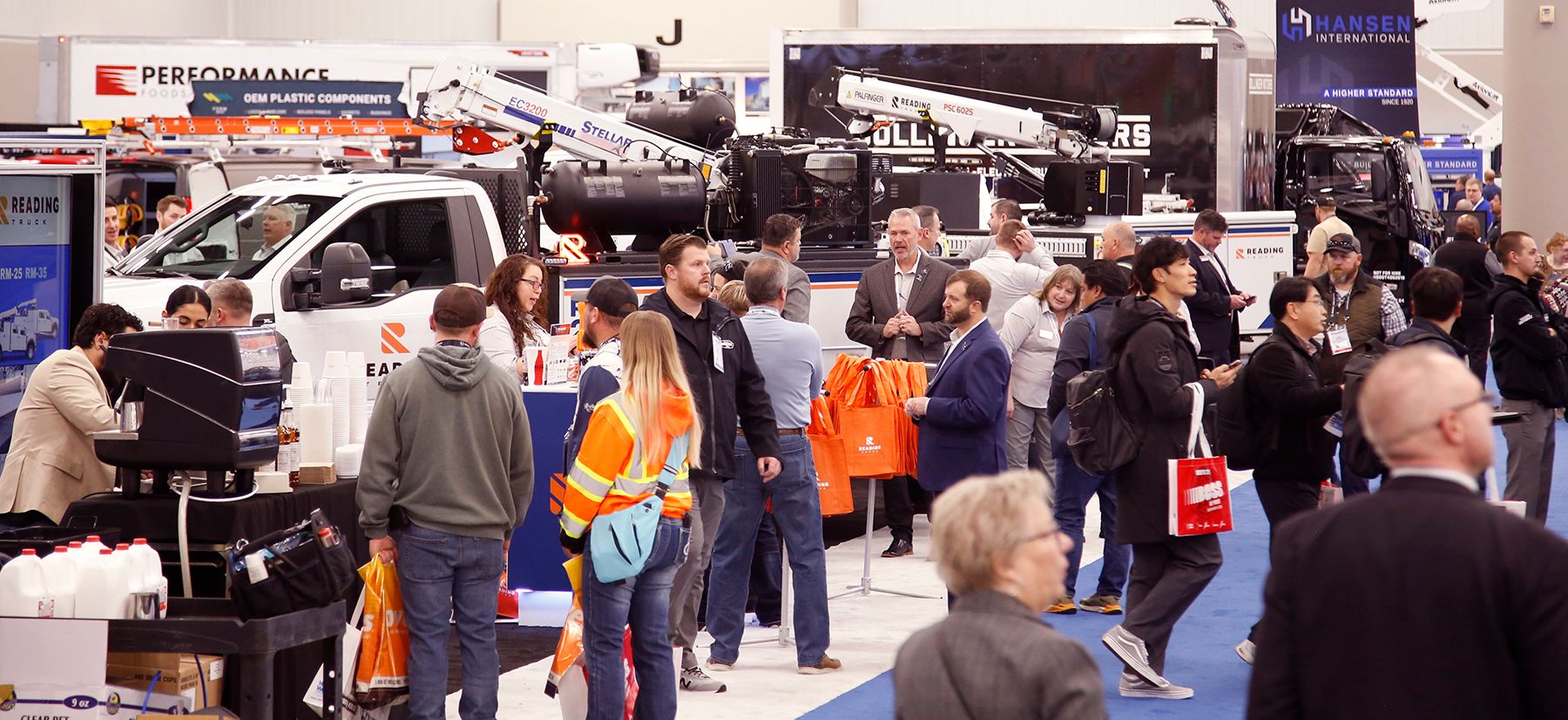 Industry professionals walking through the Work Truck Week exhibit hall, exploring commercial vehicles, equipment, and products from over 500 exhibiting companies.