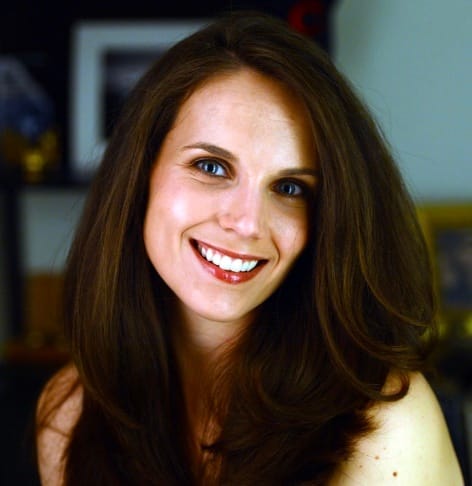 Headshot of Erin Wittkop-Coffey. She is a woman with long dark brown hair and blue eyes.