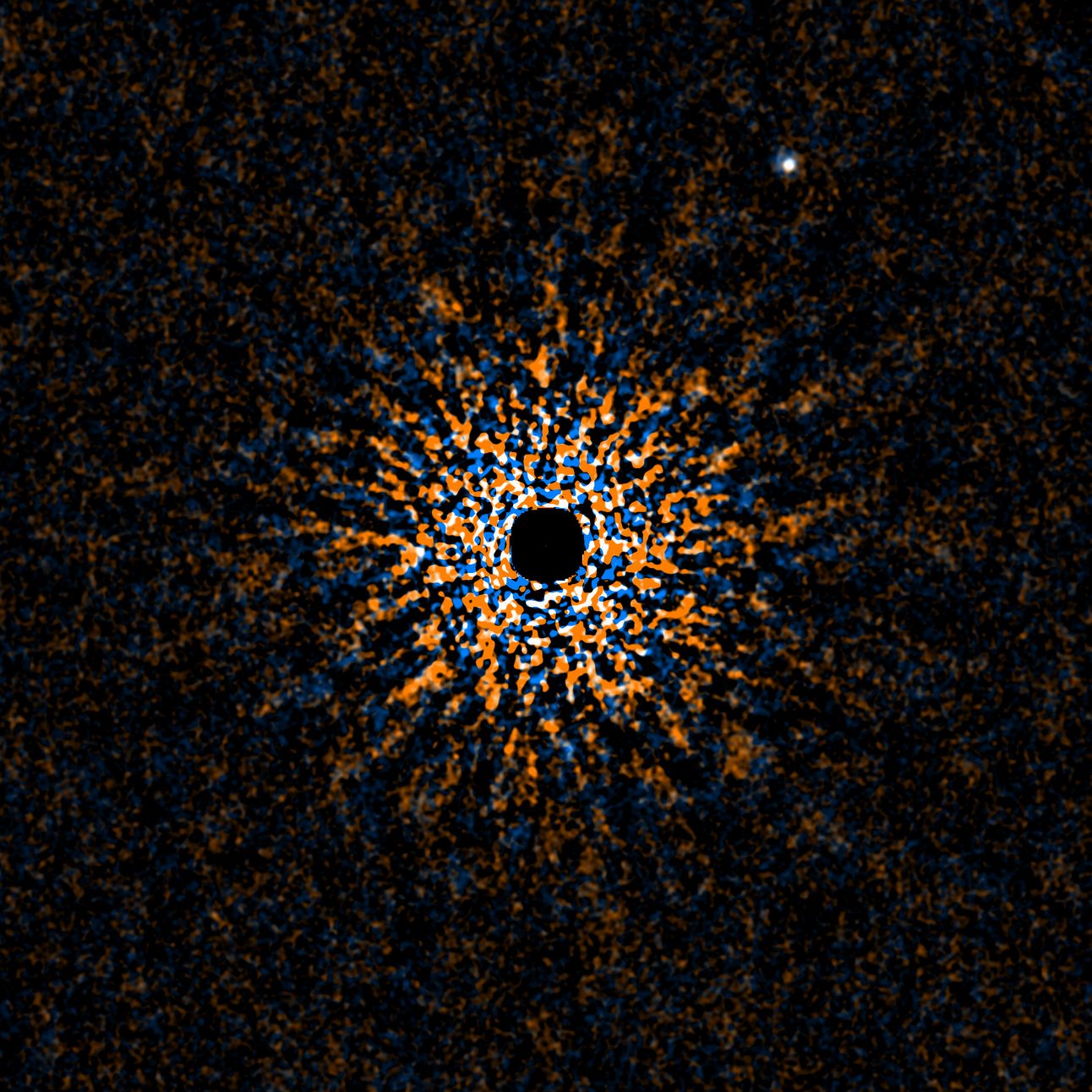 GJ 504 b is a faint, cold exoplanet orbiting the sun-like star GJ 504 in the constellation Virgo, roughly 60 light-years from Earth. Estimated to be three to six times the mass of Jupiter, it is the least massive planet ever directly imaged. Discovered by the SEEDS project using Subaru Telescope’s HiCIAO coronagraph and AO188 adaptive optics system, GJ 504 b appears in the image’s upper right, about 44 astronomical units from its host star—a distance comparable to that between the Sun and Pluto. Its low temperature (~500 K) and relatively clear atmosphere offer valuable insights into exoplanetary characteristics