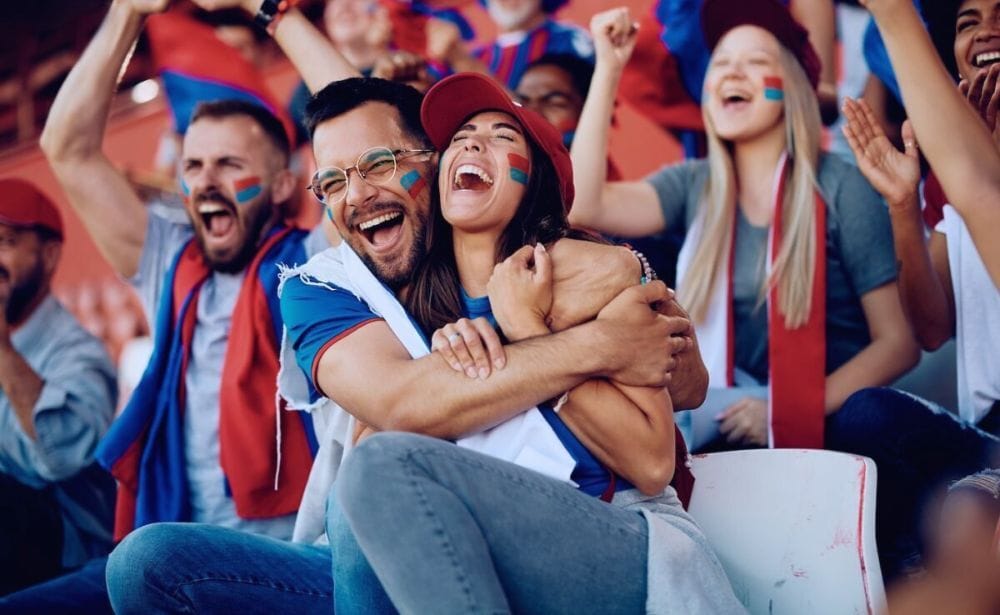 people cheering on a soccer game