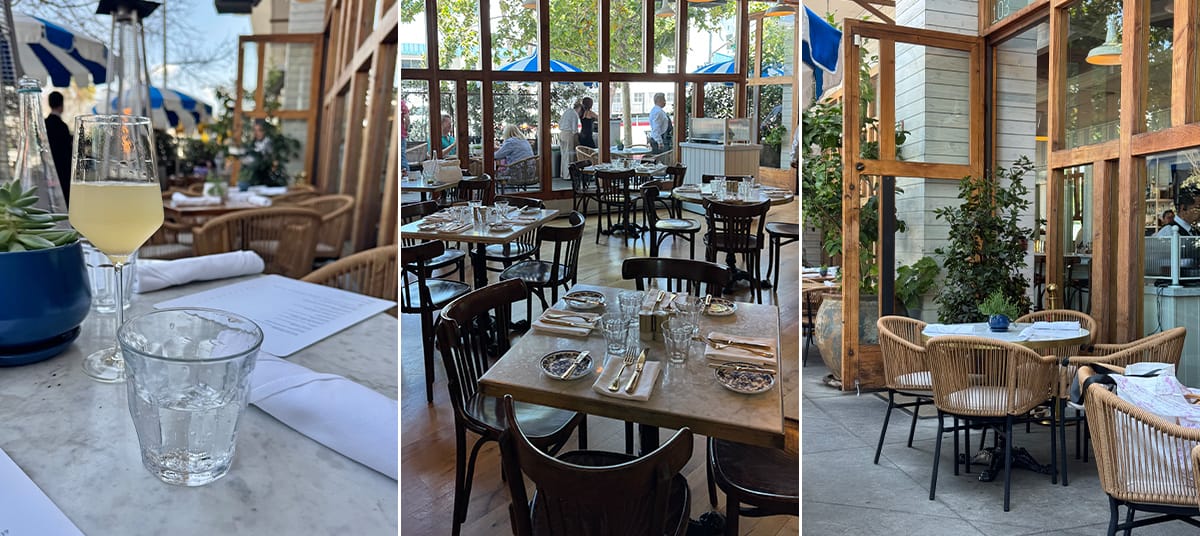 Elegant brunch setup at Bianca Restaurant in Culver City featuring marble tables, rattan chairs, and a cozy indoor-outdoor space with natural light and greenery