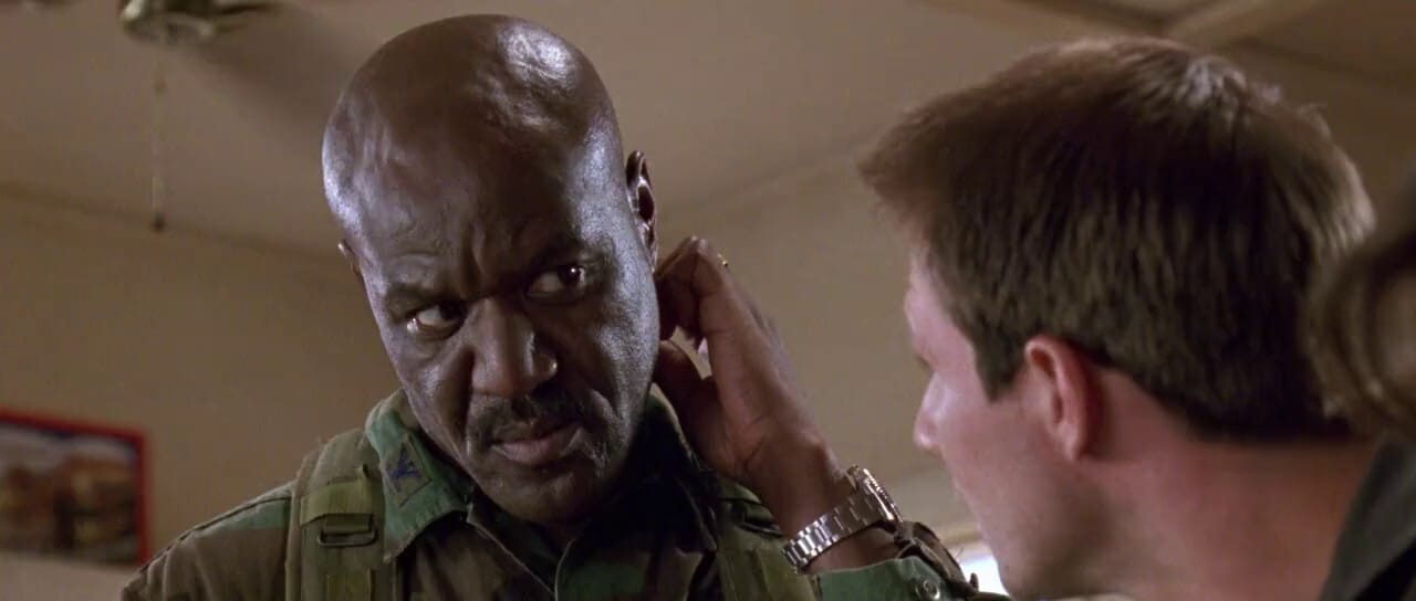 Delroy Lindo as a military officer in a high-stakes scene from Broken Arrow, a 1996 John Woo action film, with a commanding presence.