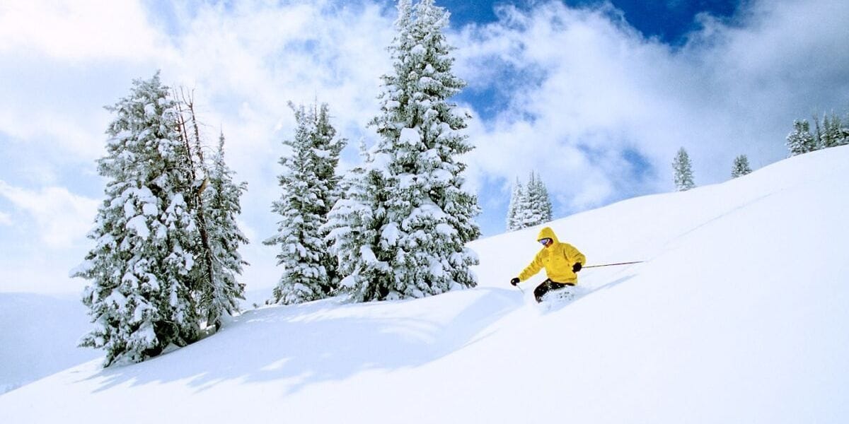 someone skiing down a snowy slope