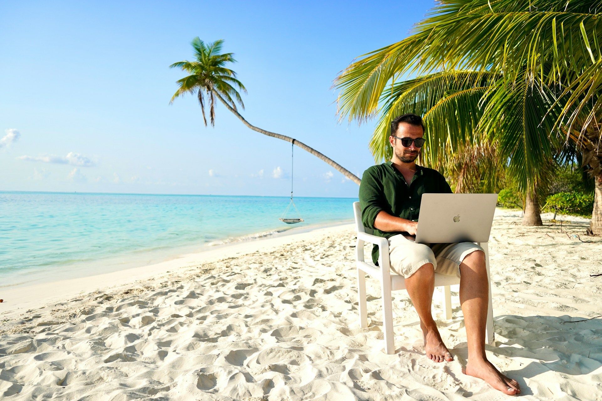 Man working on laptop in Maldives
