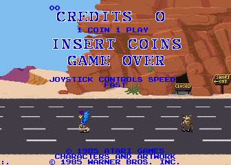 The title screen for the Atari arcade game, Road Runner, which has "Insert Coin" and credit information as well as copyrights, but also shows a demo of the Road Runner speeding away from Wile E. Coyote out on a road in the desert.