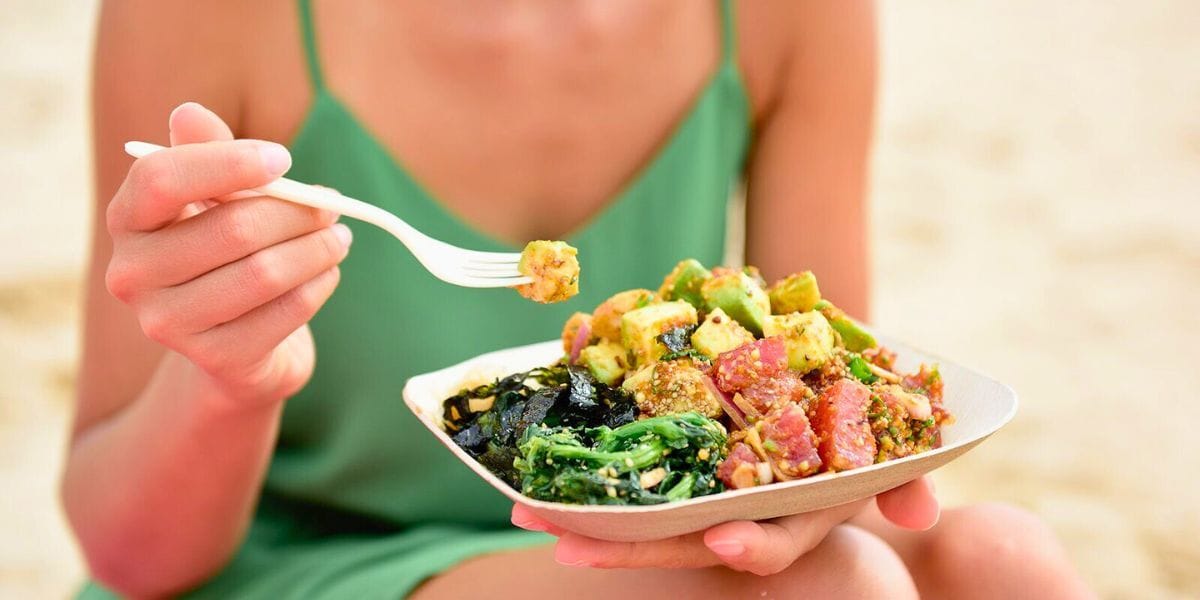 a girl eating poke