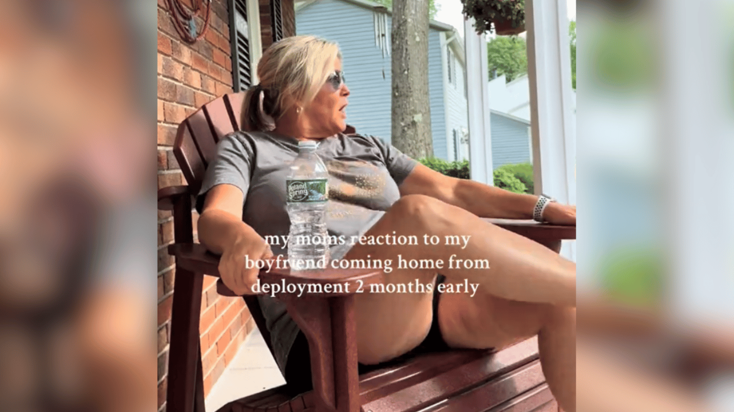 a woman sitting on a chair on her porch, looking shocked