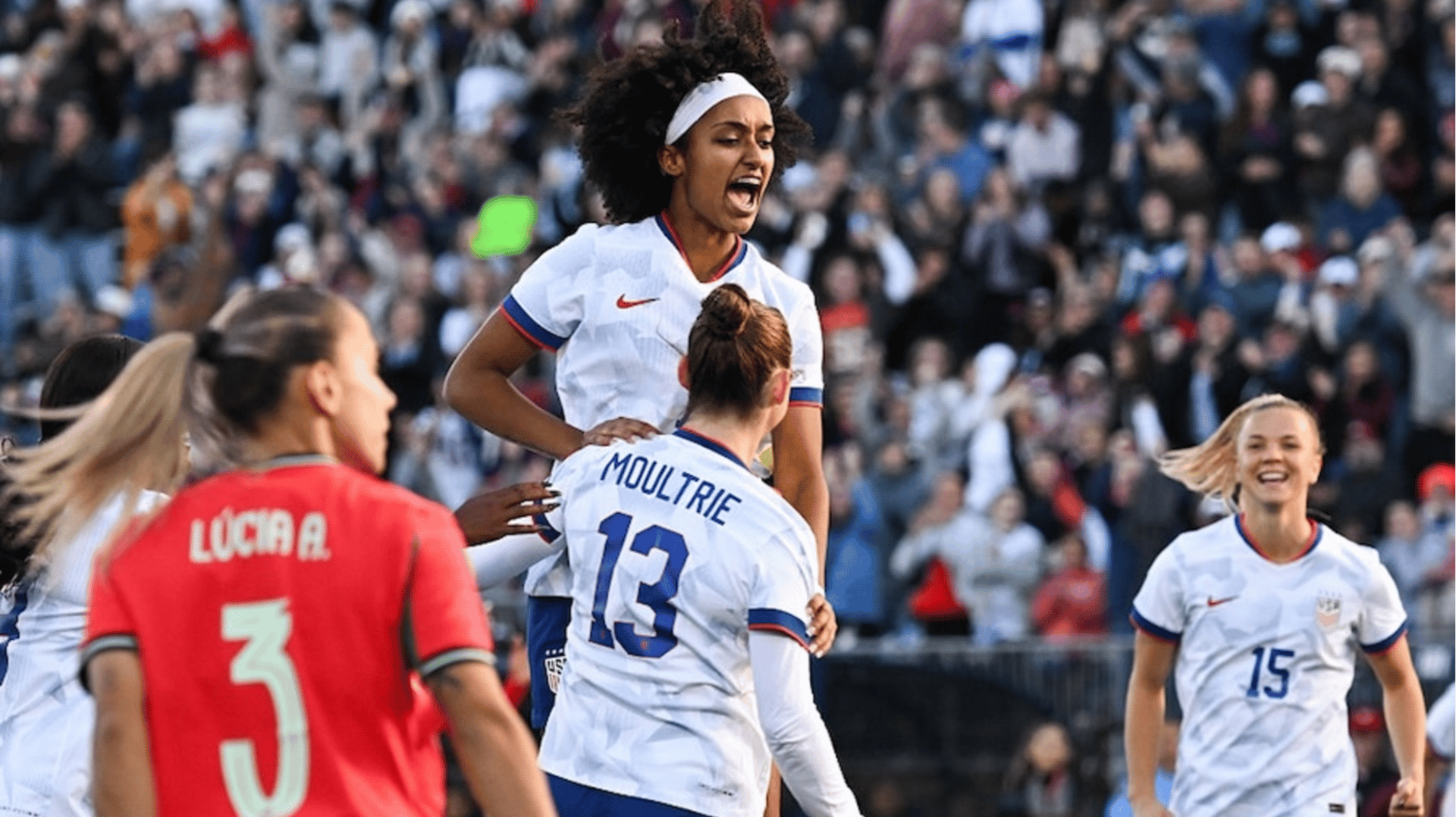 Olivia Moultrie #13 of the United States celebrates scoring a goal in the first half with Lily Yohannes #7 of the United States