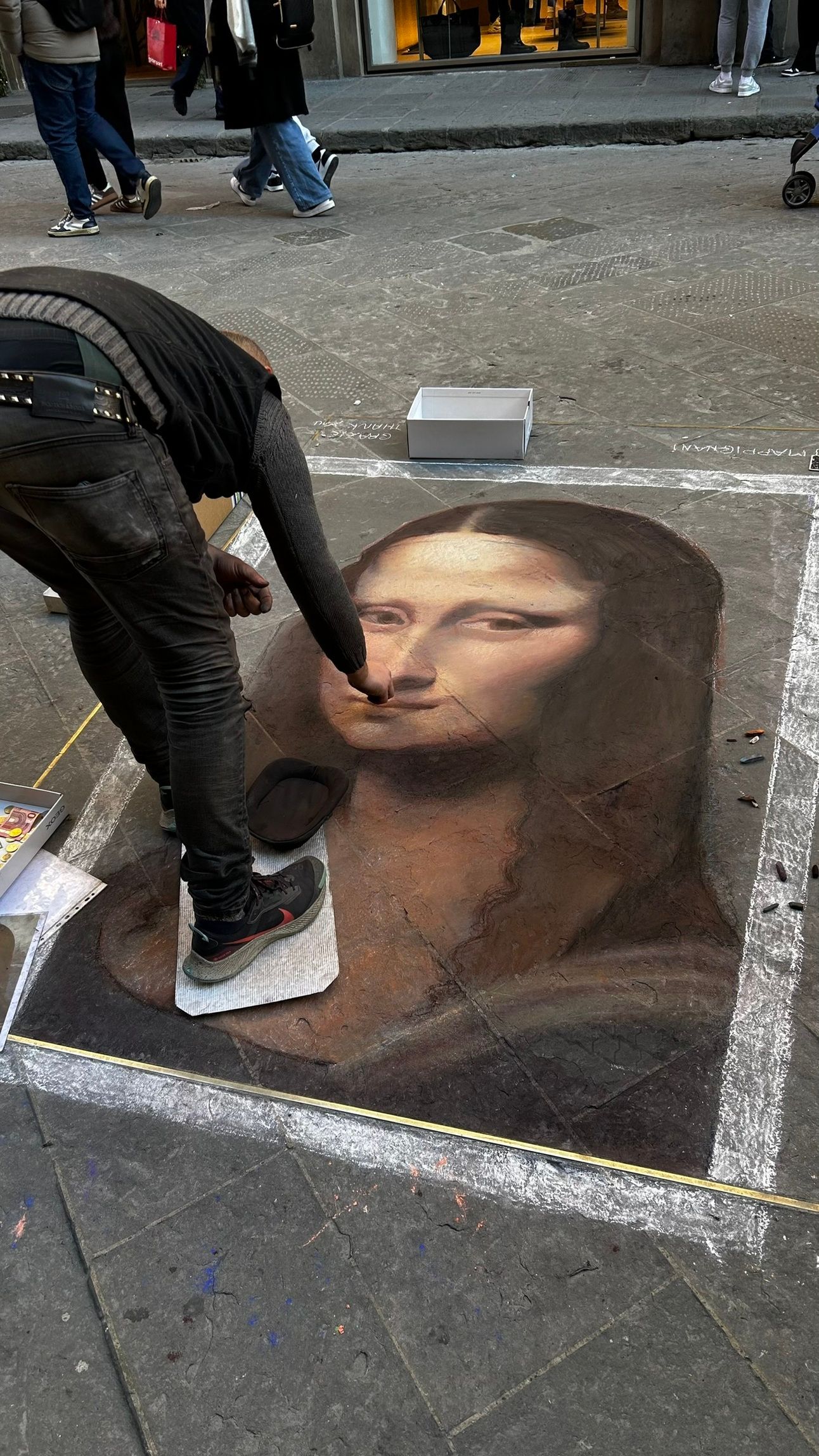 A talented street artist sketching the Mona Lisa in Florence, blending Renaissance charm with urban creativity. Just like fine wine, art evolves—bring home a bottle with Jimmy the Fox Bottle Italy Wine Travel Bag.