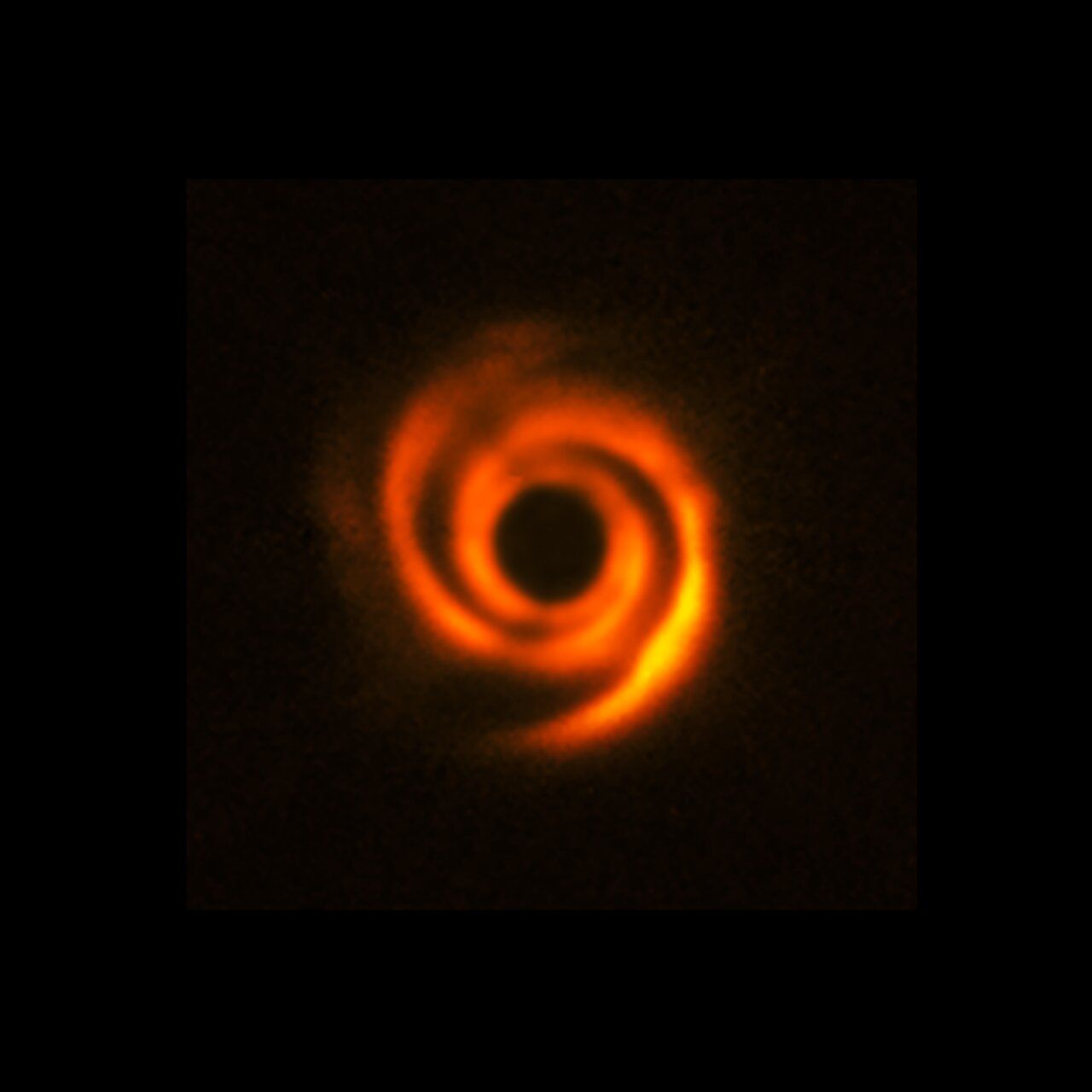 This image, which was released in 2016, was obtained with the Spectro-Polarimetric High-contrast Exoplanet Research (SPHERE) instrument. Spiral features like these can be sculpted by planets, although this image doesn’t show evidence of companions orbiting HD 135344B. However, new observations at somewhat longer wavelengths, obtained with the Enhanced Resolution Imager and Spectrograph (ERIS) at the VLT, have found a possible young planet around this star. (Credit: ESO/T. Stolker et al.)