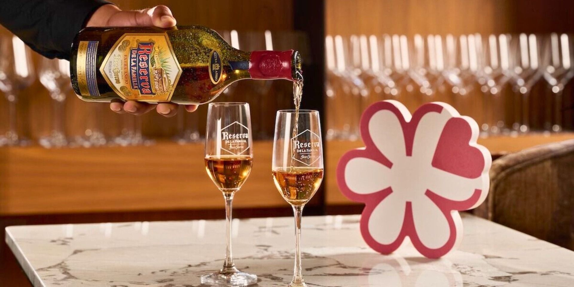 pouring two glasses of tequila