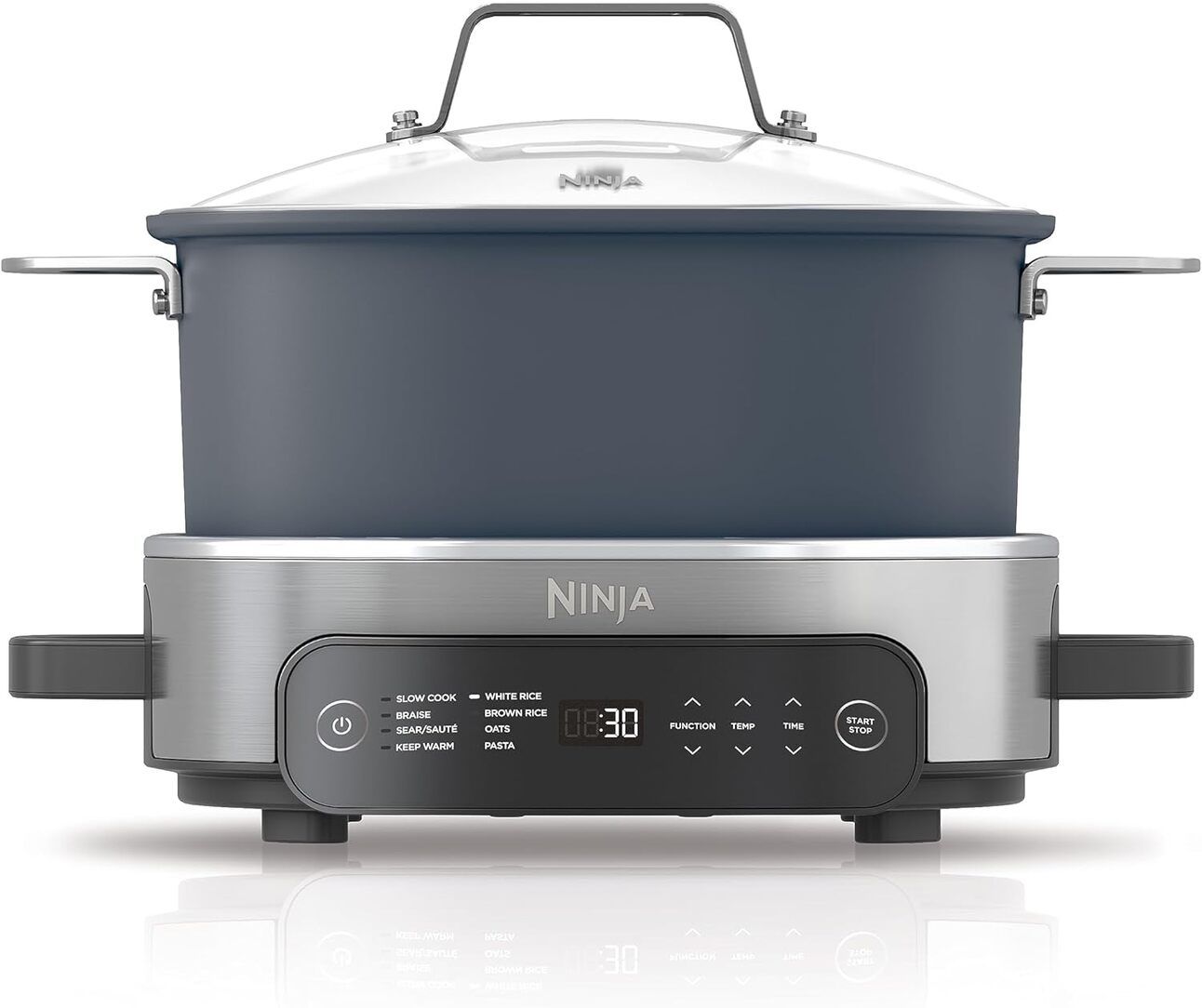 Ninja MC1101 Foodi Everyday Possible Cooker Pro – A deep blue, multi-function cooker with adjustable knob controls, shown surrounded by family-sized dishes like pot roast and vegetables. Built-in temperature settings visible.