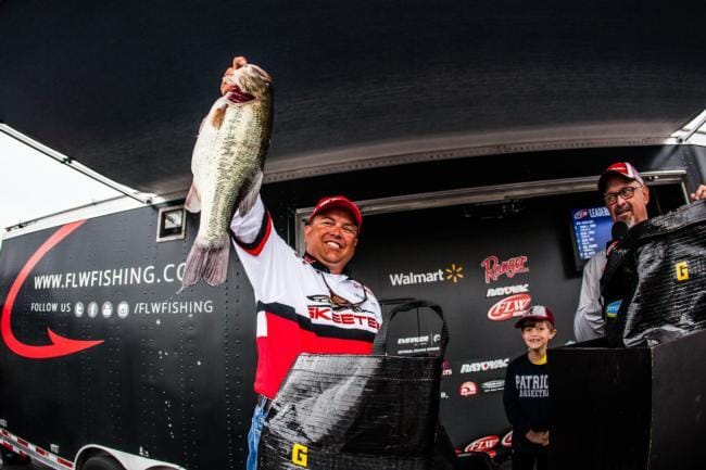 Jay Kendrick hoists one of his giant bass from day three.