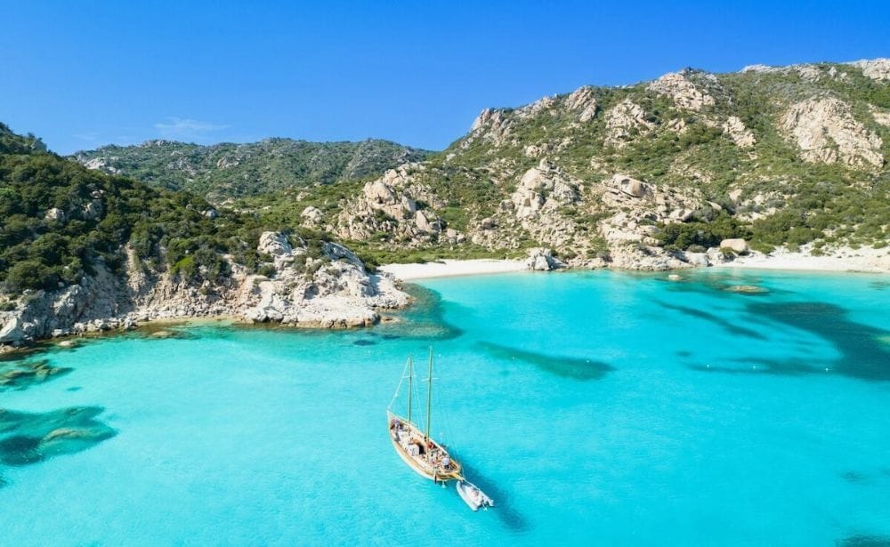 a boat off the coast of an island