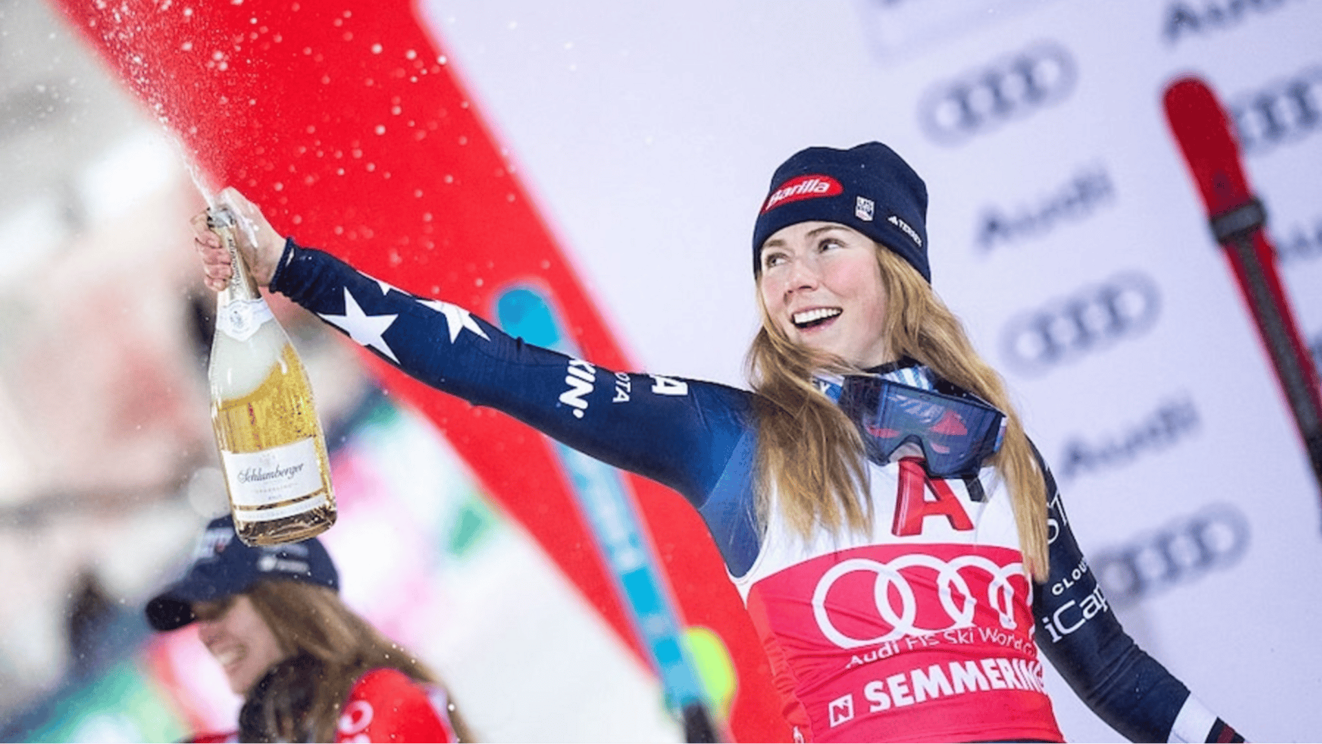 Winner USA's Mikaela Shiffrin celebrates on the podium with sparkling wine after the Women's Slalom race of the FIS Alpine Ski World Cup