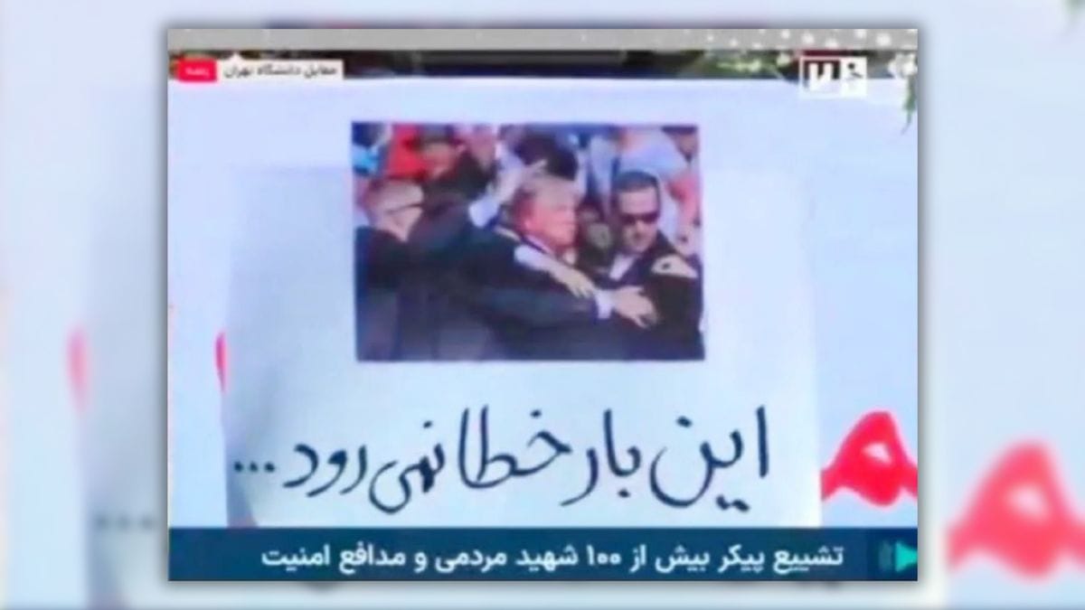 A screenshot shows an image of a white man surrounded by a crowd of people. Words in Farsi, Iran's official language, are seen below the image.