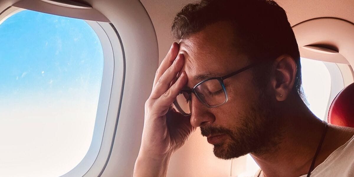 a traveler with a sinus headache