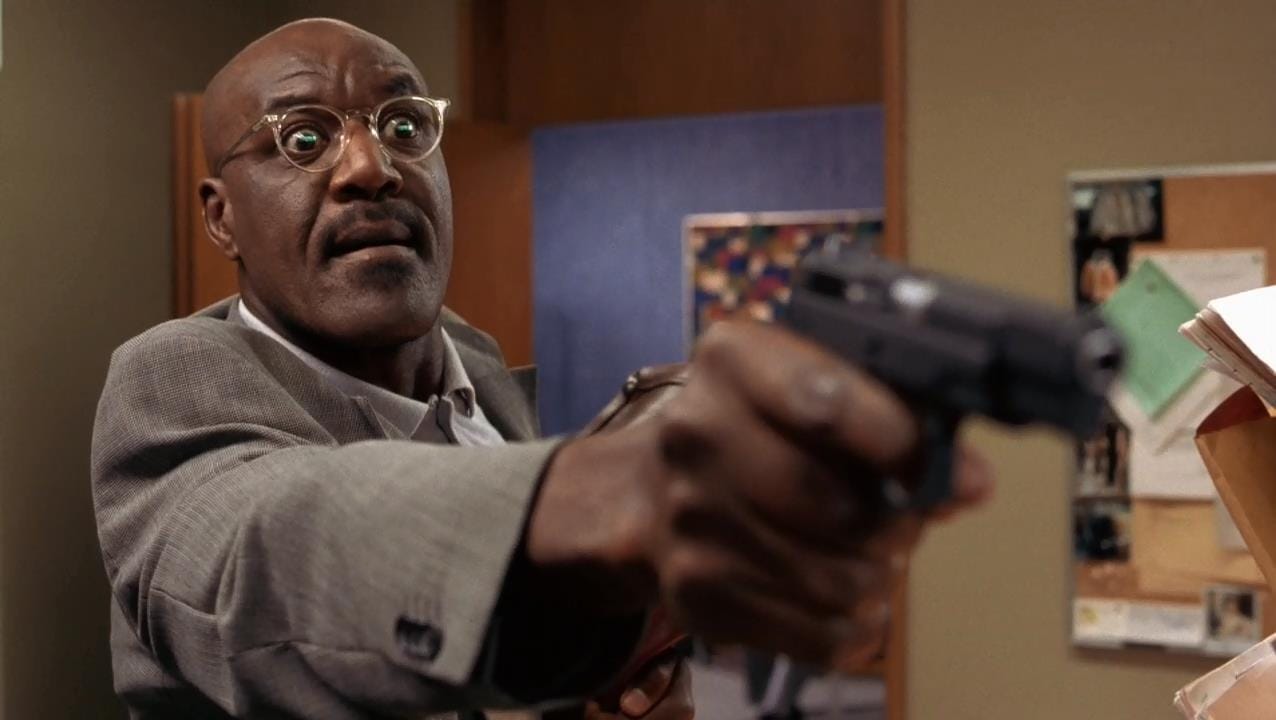  Delroy Lindo as a cunning criminal in a dramatic moment from Heist, a 2001 David Mamet thriller, with a focused expression.