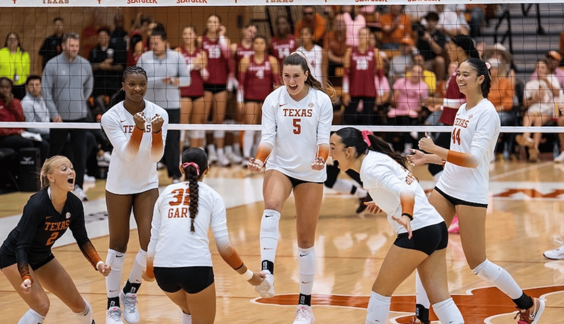 The team celebrates after a point during the Texas vs Oklahoma volleyball game on October 19, 2025