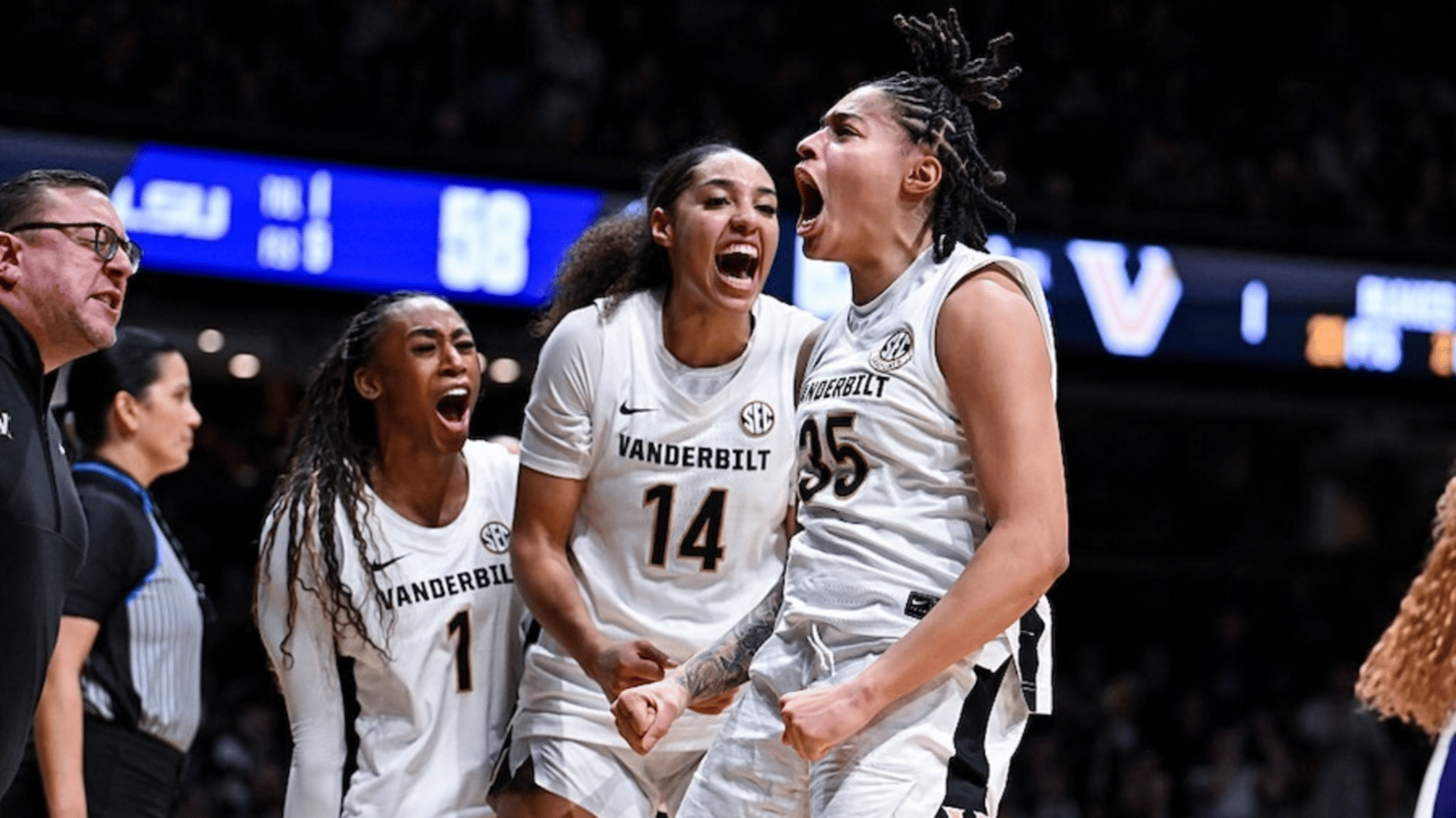 Sacha Washington #35, Aiyana Mitchell #14 and Mikayla Blakes #1 of the Vanderbilt Commodores react to a play against the LSU Tigers