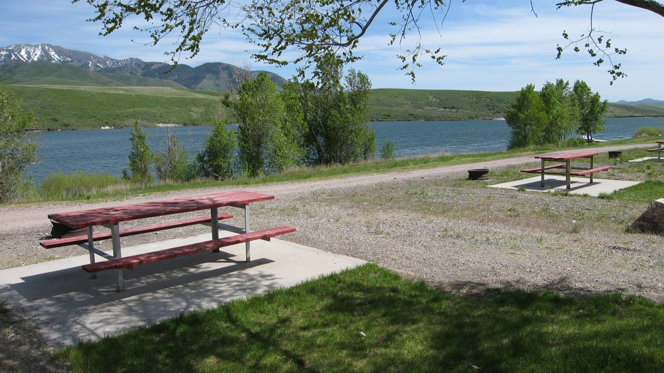 picnic benches by river at rv park