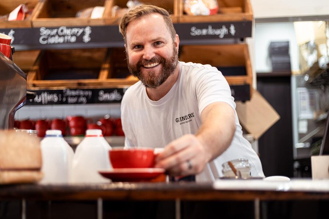 Barista serving coffee